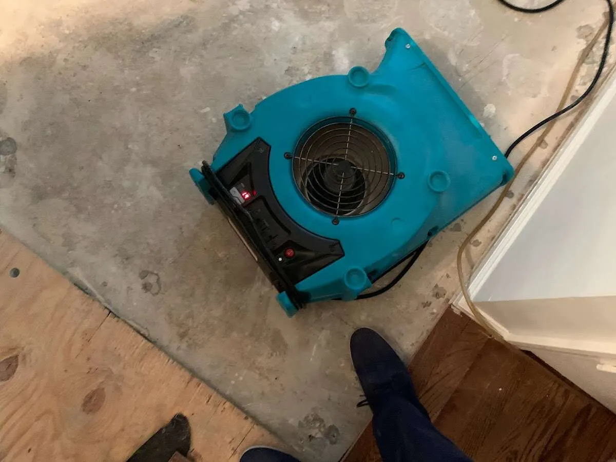 Air mover drying subfloor during Leak Detection & Repair in Indianapolis